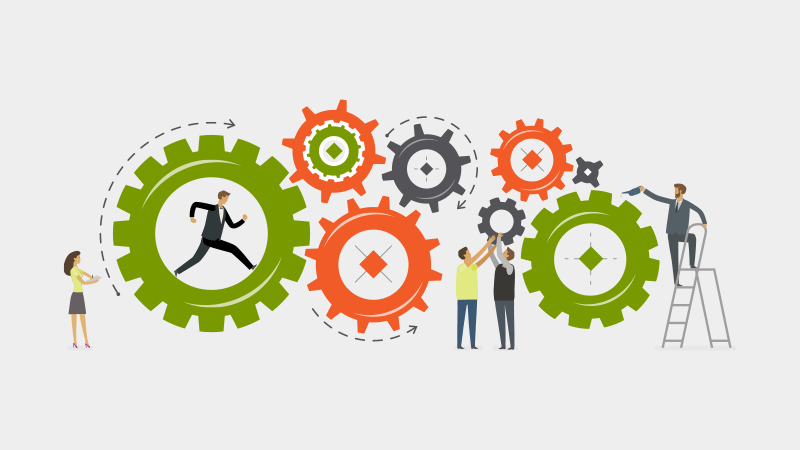 Employees spinning oversized gears to improve business processes