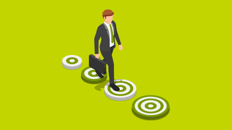 An employee stepping on targets as they reach business goals through automation